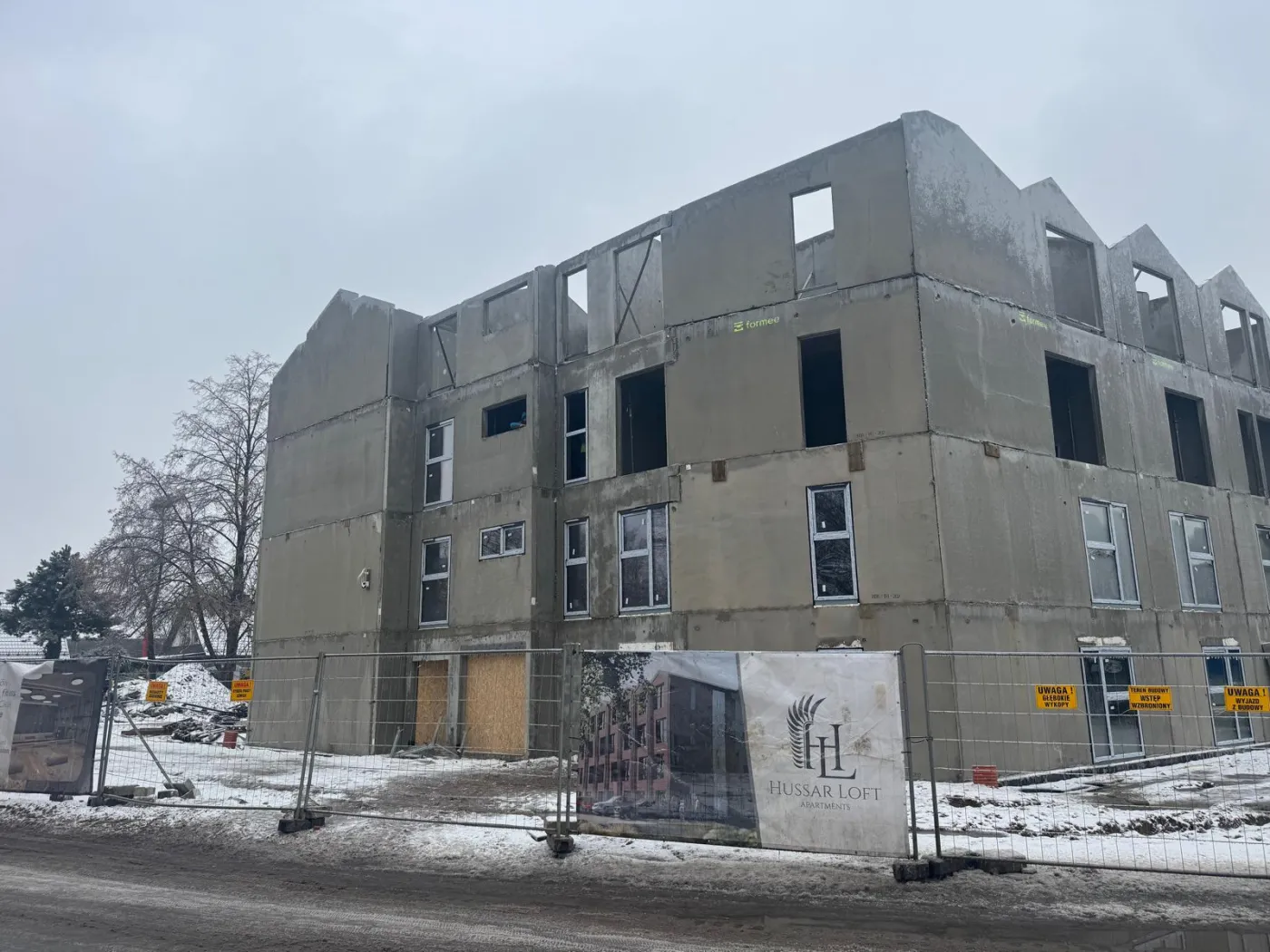 Hussar Loft in Szczecin — windows downstairs, walls still rising upstairs